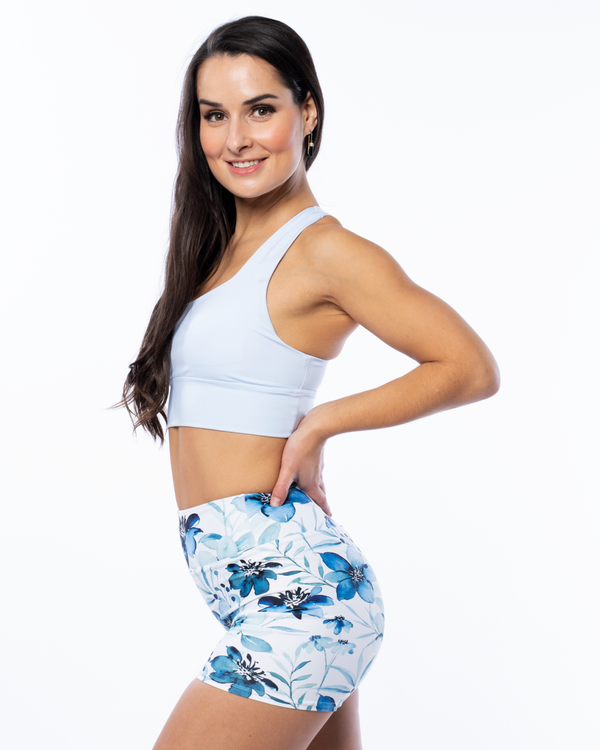 blue matching set high waisted floral shorts and light blue sports bra