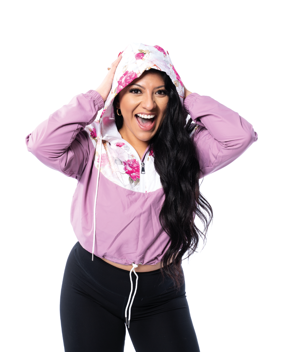 happy girl wearing a windbreaker cropped purple jacket with floral pattern and hoodie on